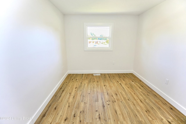 unfurnished room with light hardwood / wood-style floors