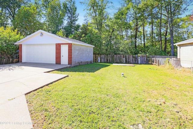 view of yard with an outbuilding and a garage