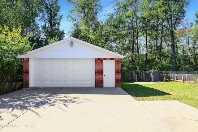 garage with a yard