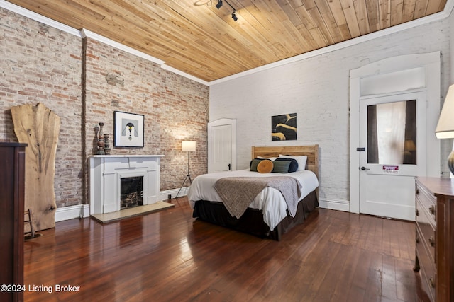 bedroom with wooden ceiling, hardwood / wood-style flooring, and ornamental molding