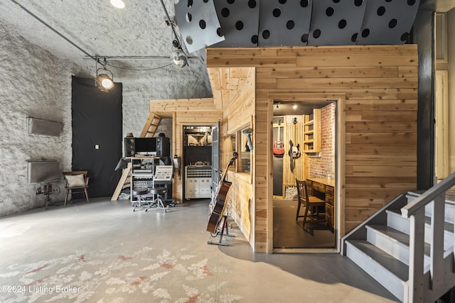 interior space featuring wood walls