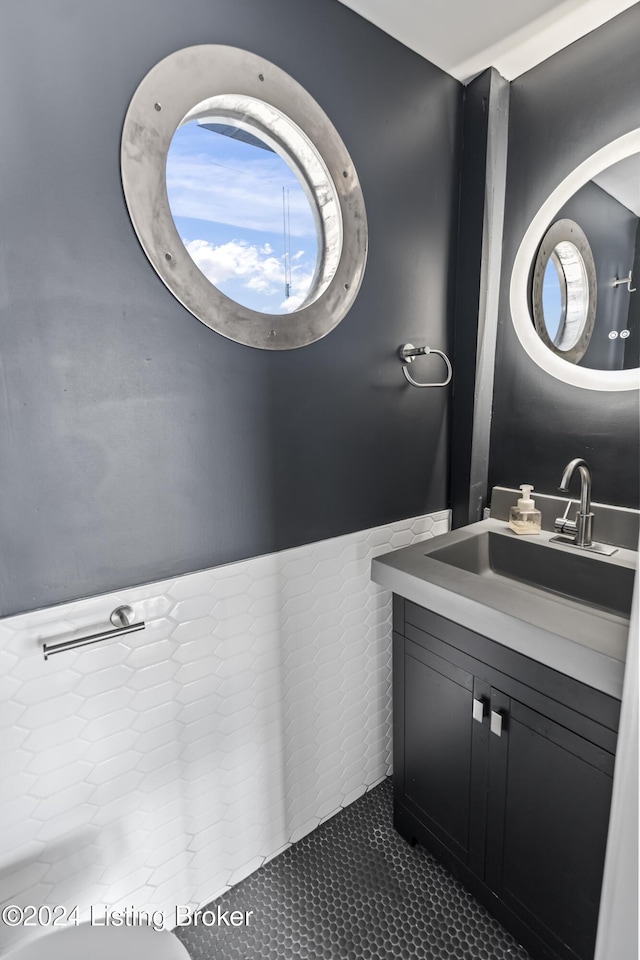 bathroom with tile patterned flooring and vanity