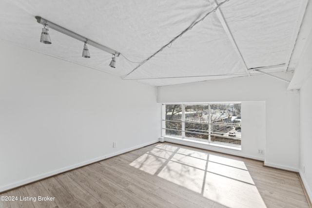 spare room with light wood-type flooring