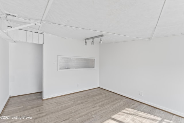 unfurnished room with light hardwood / wood-style flooring