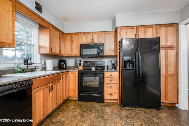 kitchen featuring black appliances and sink