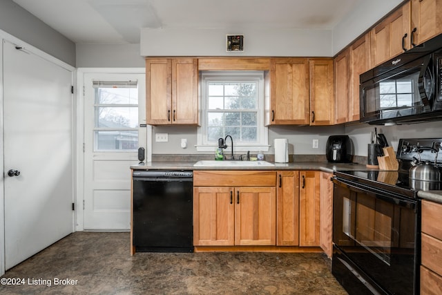 kitchen with sink, plenty of natural light, and black appliances