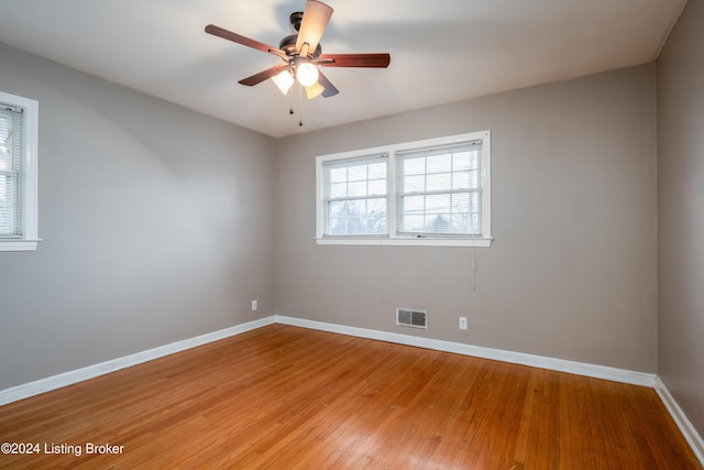 unfurnished room with light hardwood / wood-style flooring and ceiling fan