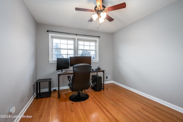 office space with ceiling fan and light hardwood / wood-style floors