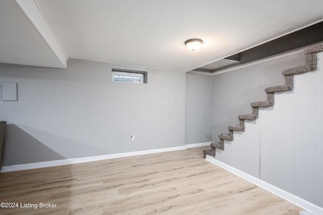 basement featuring light hardwood / wood-style floors