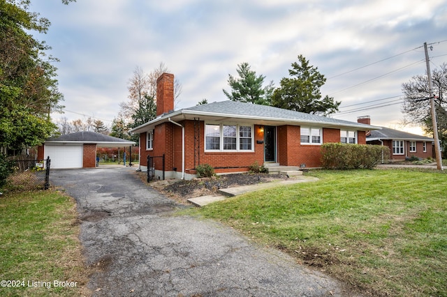 single story home with a front yard, a garage, a carport, and an outdoor structure