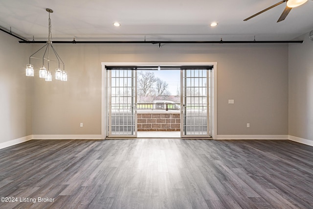 unfurnished room with wood-type flooring and ceiling fan