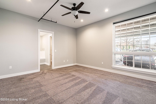 carpeted empty room with ceiling fan