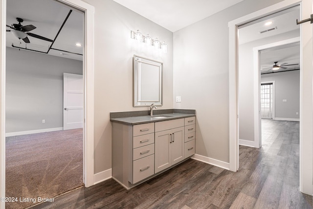 bathroom featuring hardwood / wood-style floors, vanity, and ceiling fan