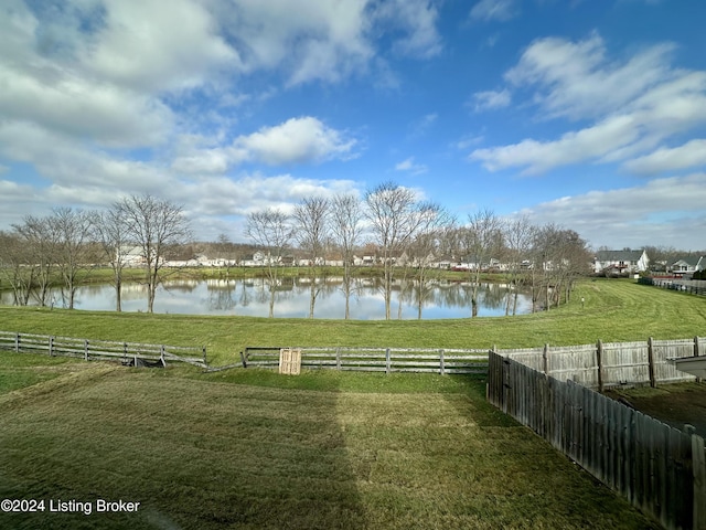 view of yard featuring a rural view and a water view