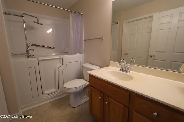 bathroom featuring vanity, a shower with shower curtain, and toilet