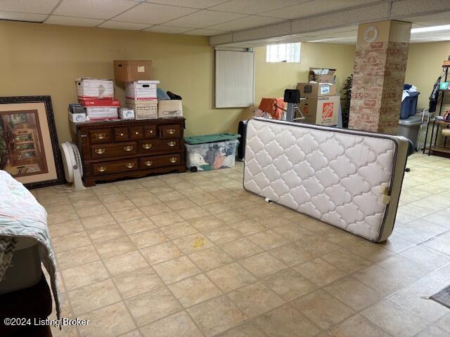 bedroom with a paneled ceiling