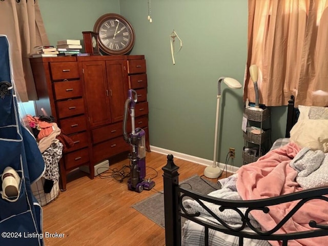 bedroom with light hardwood / wood-style flooring