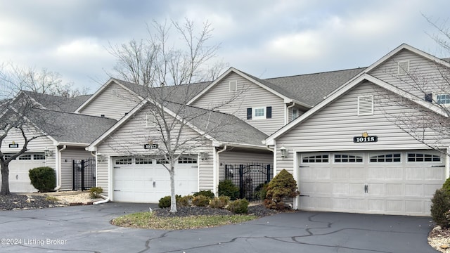 front facade with a garage