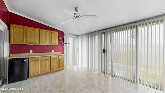 kitchen featuring black fridge, ceiling fan, and lofted ceiling