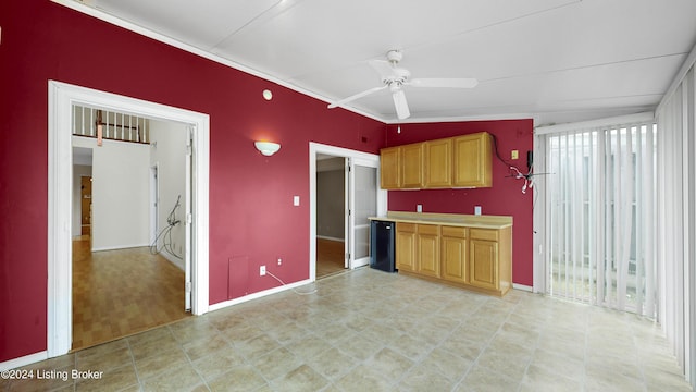 kitchen with light hardwood / wood-style floors, vaulted ceiling, ceiling fan, and a healthy amount of sunlight