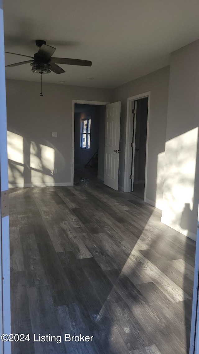 exterior space with ceiling fan and wood-type flooring