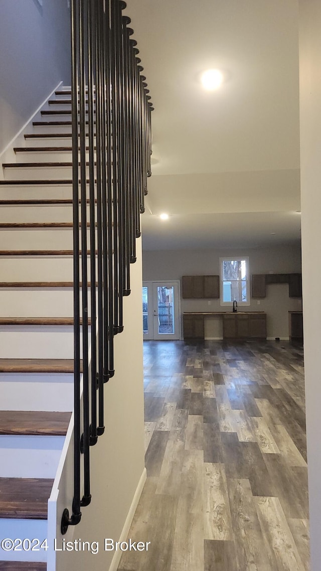 stairway featuring hardwood / wood-style floors