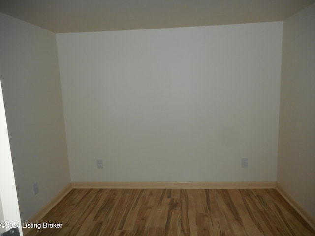 spare room with hardwood / wood-style flooring