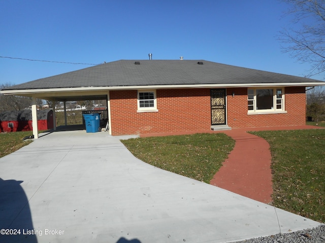 exterior space with a front yard and a carport