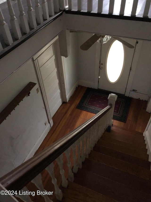 stairway with wood finished floors