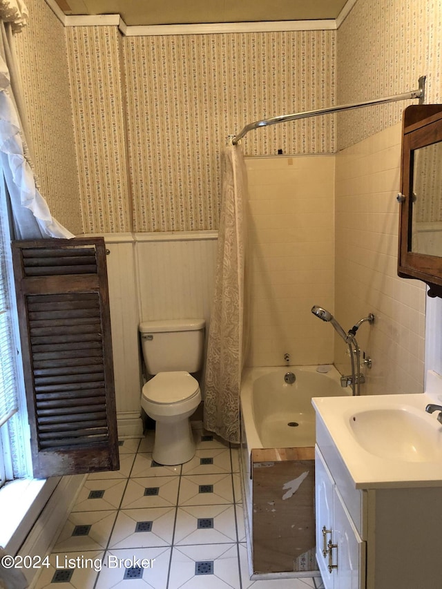 bathroom with tile patterned flooring, vanity, toilet, and shower / bath combo