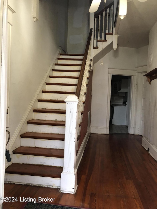 stairs with hardwood / wood-style floors