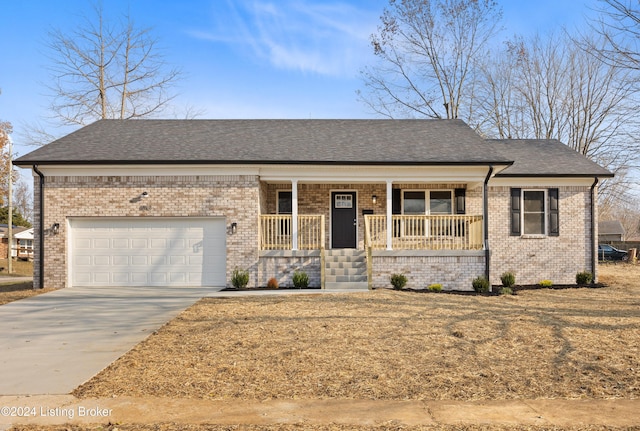 view of front of home featuring covered porch and a garage