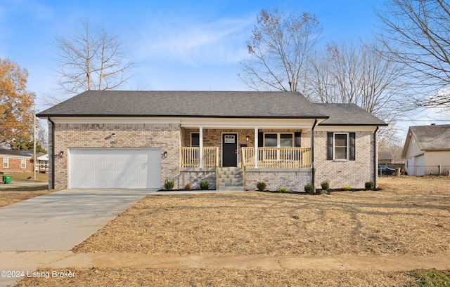 view of front of home with covered porch and a garage