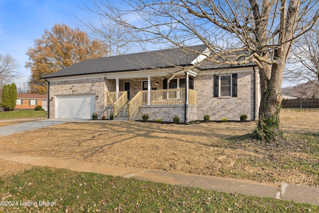 view of front of house featuring a porch and a garage