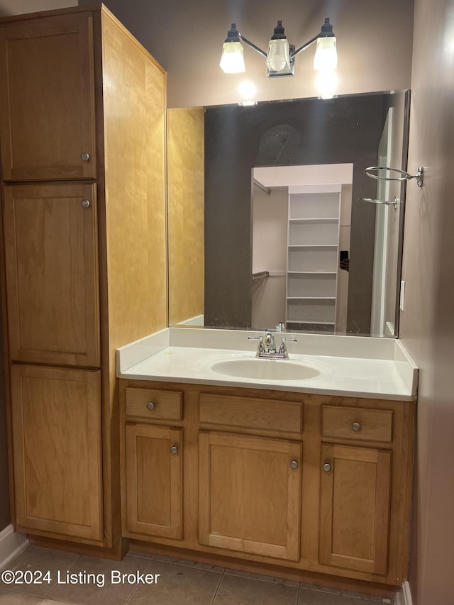 bathroom with tile patterned flooring and vanity