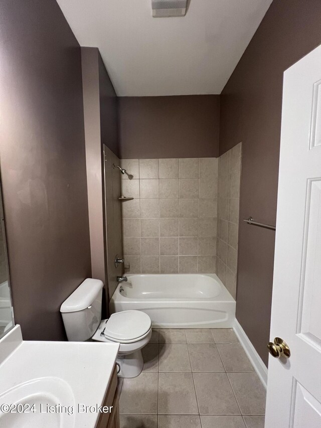 full bathroom with tile patterned floors, vanity, toilet, and tiled shower / bath