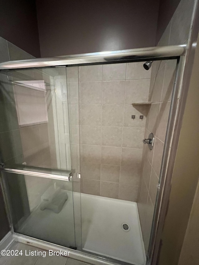 bathroom featuring an enclosed shower