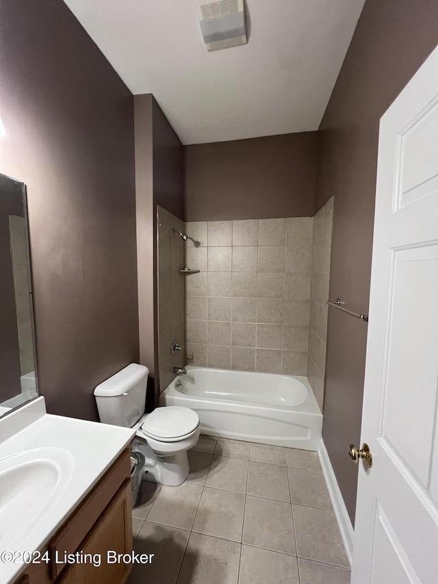 full bathroom featuring tile patterned floors, vanity, toilet, and tiled shower / bath