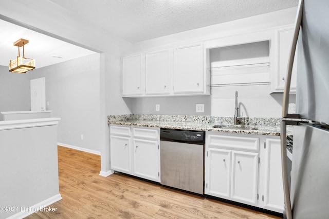 kitchen featuring white cabinets, light wood-type flooring, stainless steel appliances, and sink