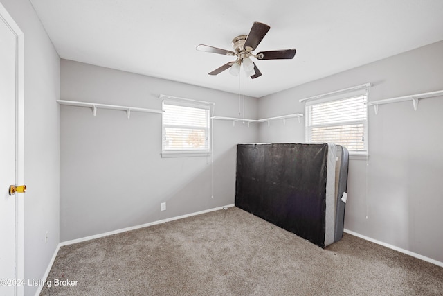 unfurnished bedroom featuring ceiling fan and light colored carpet