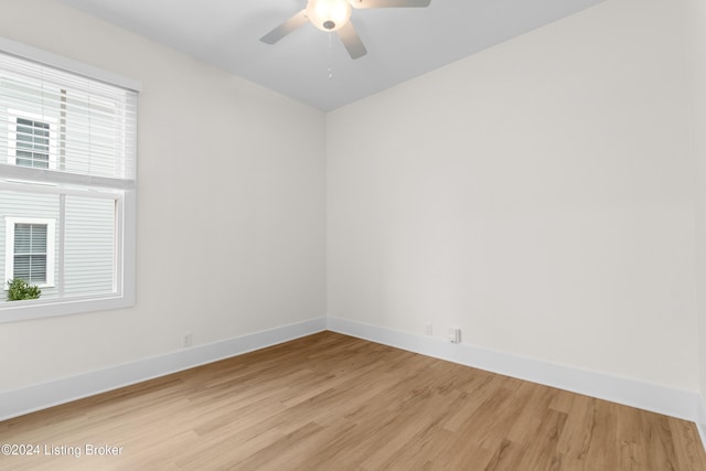 empty room featuring ceiling fan and light hardwood / wood-style flooring