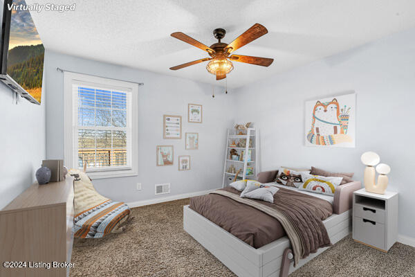 carpeted bedroom featuring ceiling fan