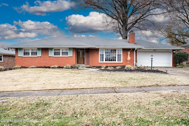 ranch-style house with a front yard and a garage