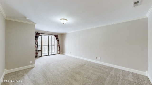 spare room with crown molding and light colored carpet