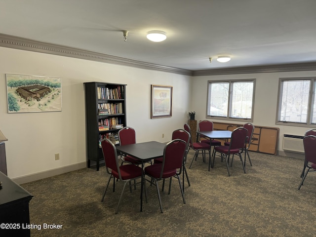 carpeted dining area with an AC wall unit and ornamental molding