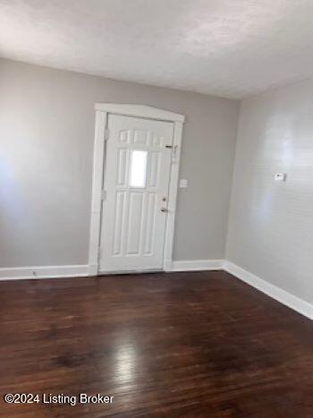 foyer entrance with dark wood-type flooring