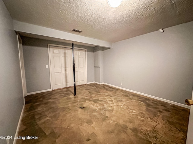 basement with a textured ceiling