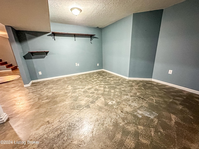 empty room featuring a textured ceiling