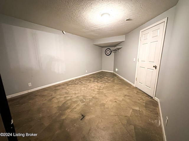 basement with a textured ceiling