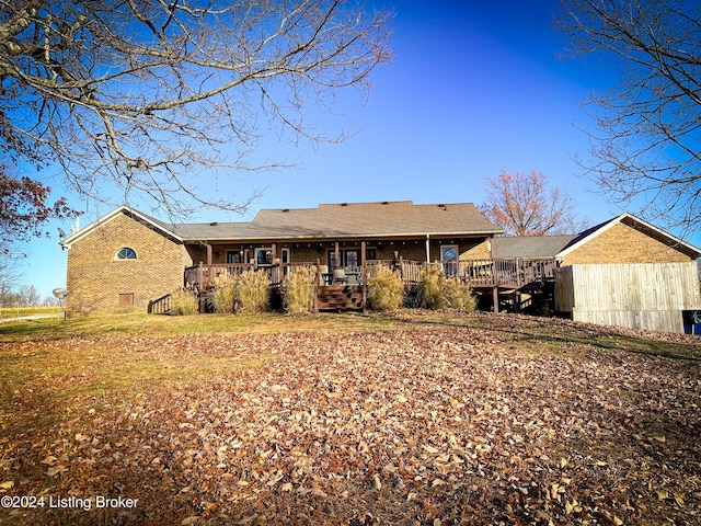 rear view of house featuring a deck